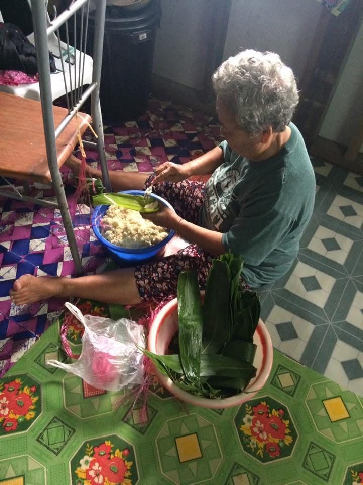 Munirih's late grandmother hard at work preparing glutinous rice for Hari Gawai. — MUNIRIH JEBENI