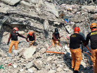 Father, son among latest fatalities in Philippine building collapse