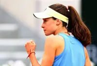 Tennis-Sonmez trips over advertisement sign, tumbles out of French Open