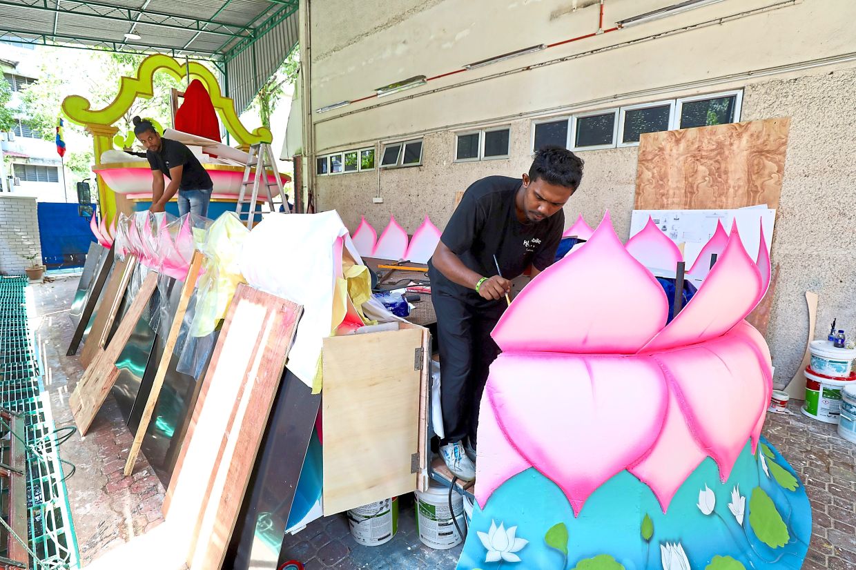 Workers preparing for the Wesak Day float procession at the Buddhist Maha Vihara. The procession takes place tomorrow at 6.30pm.