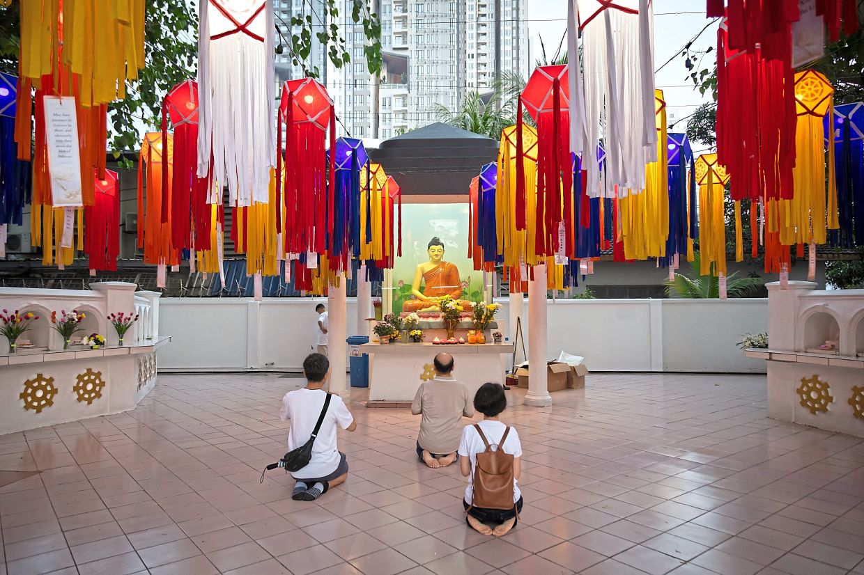 Devotees praying during the Wesak Day celebration last year at the Buddhist Maha Vihara in Brickfields, Kuala Lumpur. — Courtesy of Buddhist Maha Vihara