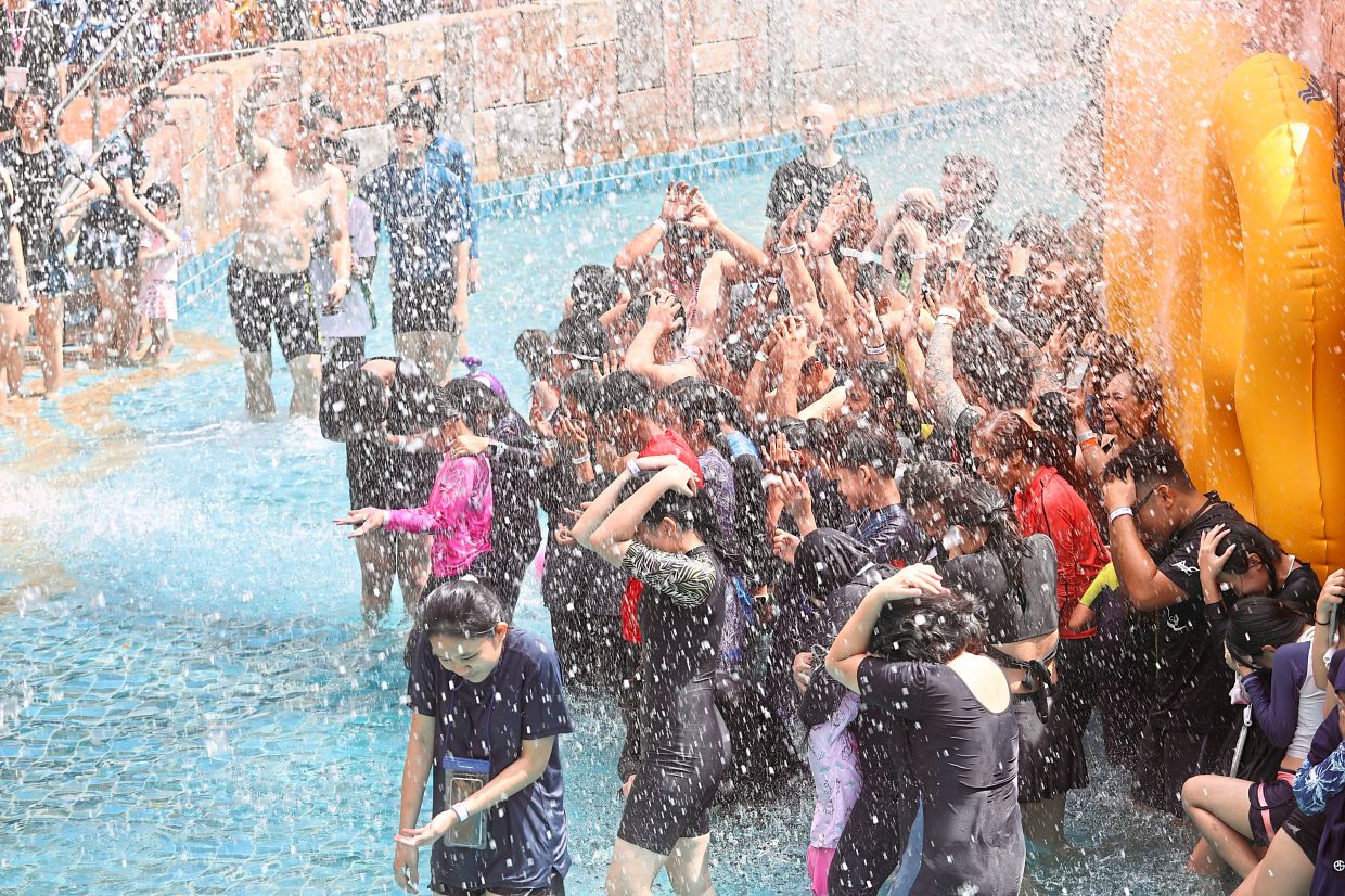 With the school holidays in full swing, ­parents are flocking to Sunway Lagoon to ride its water slides and relive childhood memories with their children.