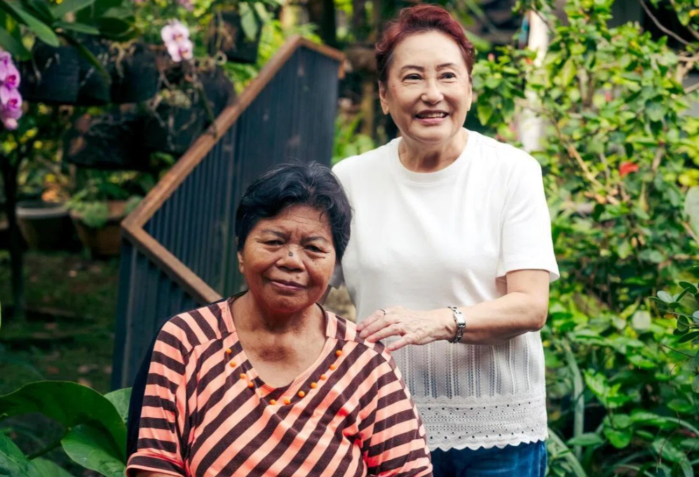 Pani (left), a live-in domestic worker, with her employer of 44 years, Ms Tokiko Latuharhary, at Ms Tokiko's home in South Tangerang, just outside Jakarta. - ST
