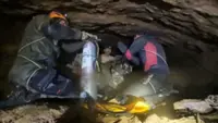 Rescuers pull four people trapped in flooded cave in Laos, Thai rescuers say