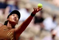 Tennis-Gold-sequined Osaka survives three-set scare against teenager Jovic