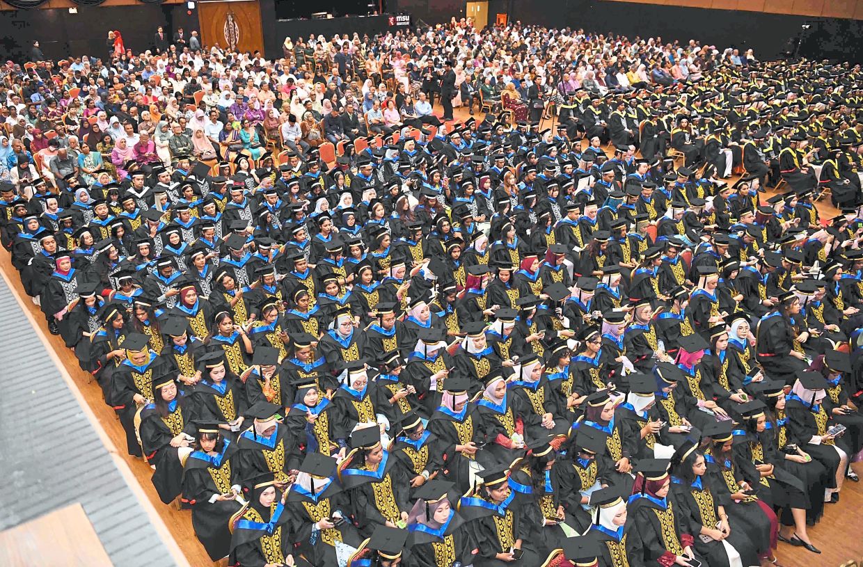 Well done: A total of 1,879 graduates from 122 academic programmes received their scrolls at the MSU Chancellor Hall in Shah Alam during the two-day ceremony.