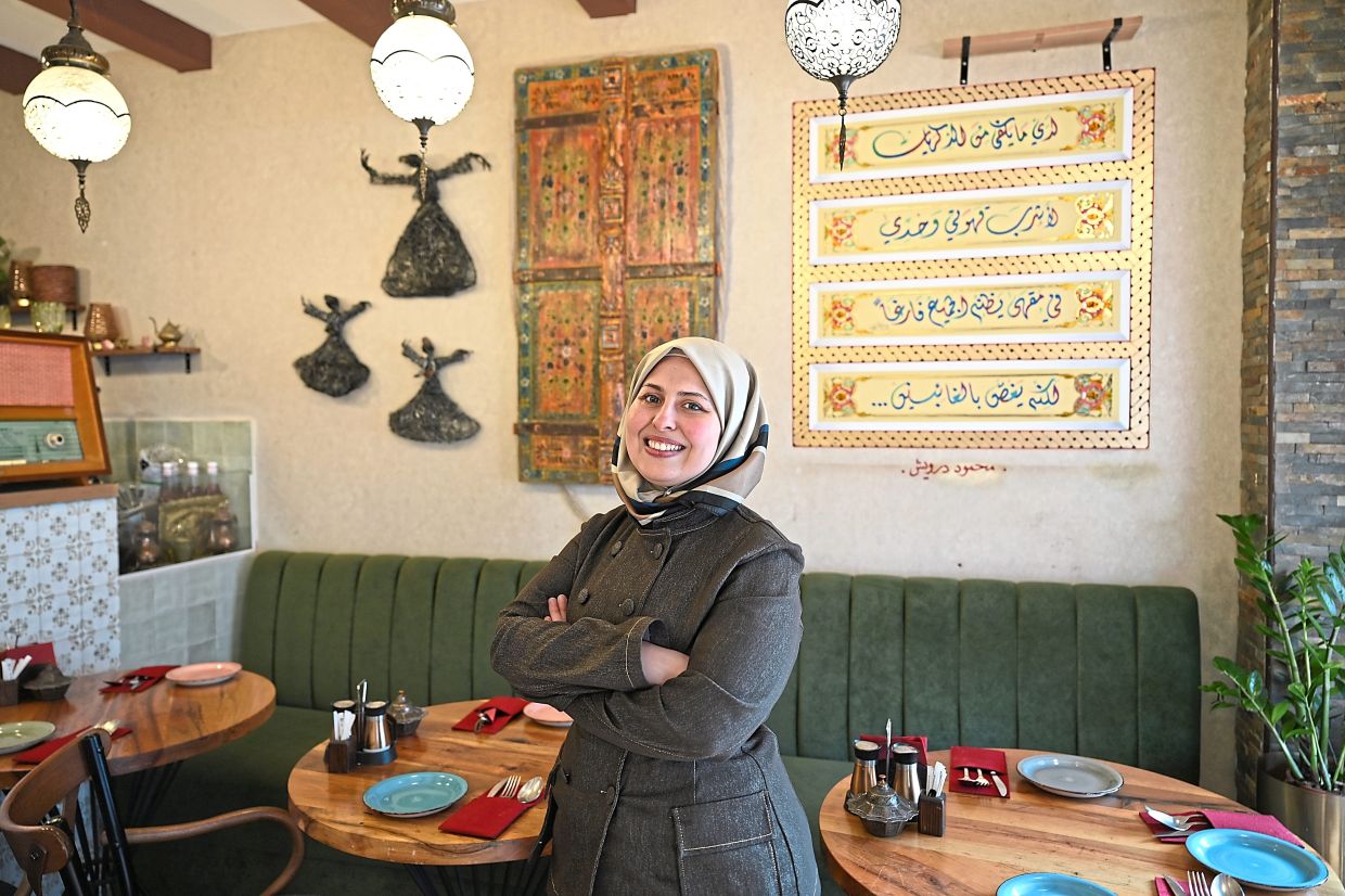 Popular in the Arab world as a TV cook, Jazmati stands in her Berlin restaurant, Malakeh, which means queen in Arabic. — MICHAEL BRANDT/dpa