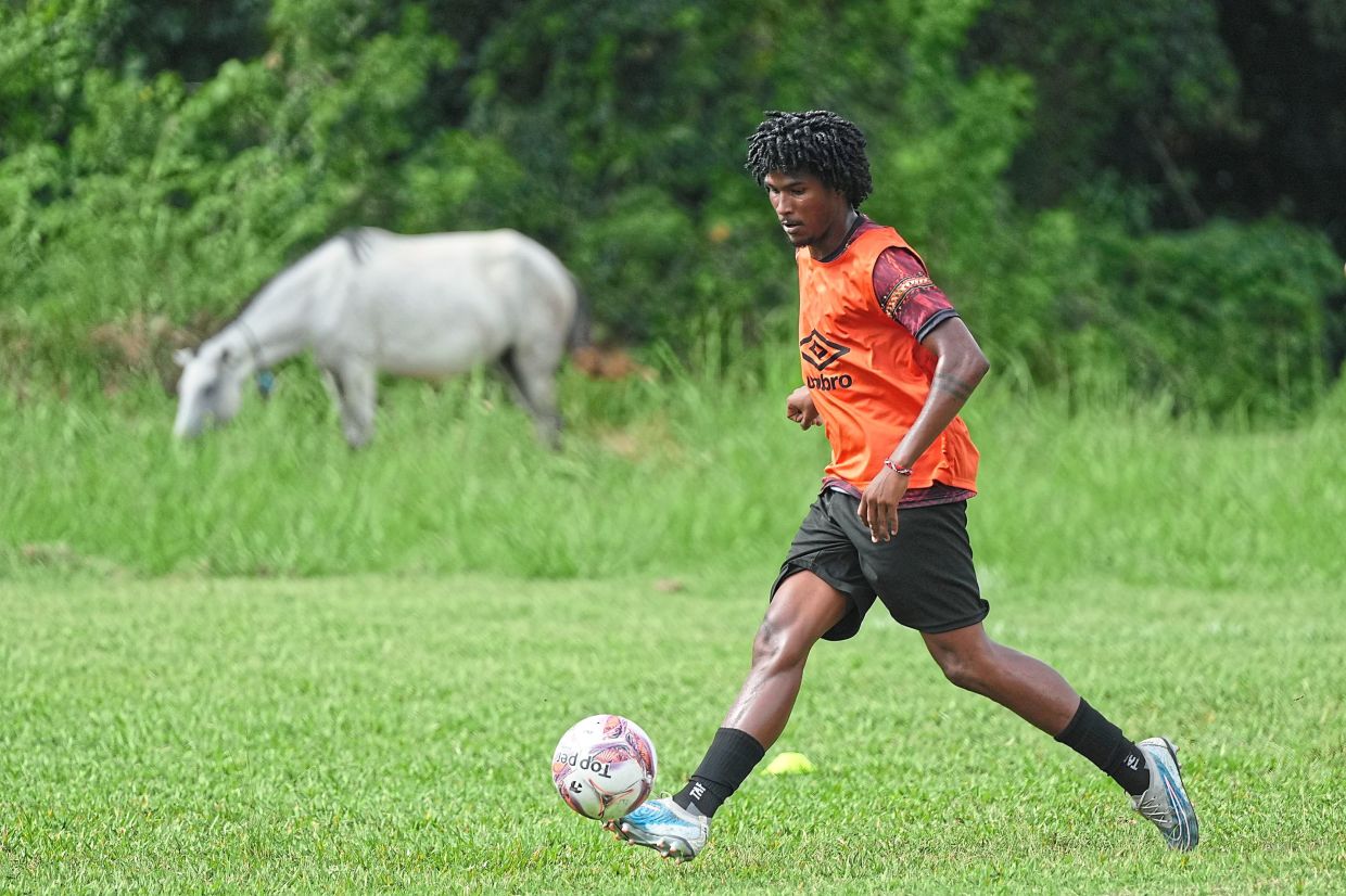 A player controls the ball during a training session.