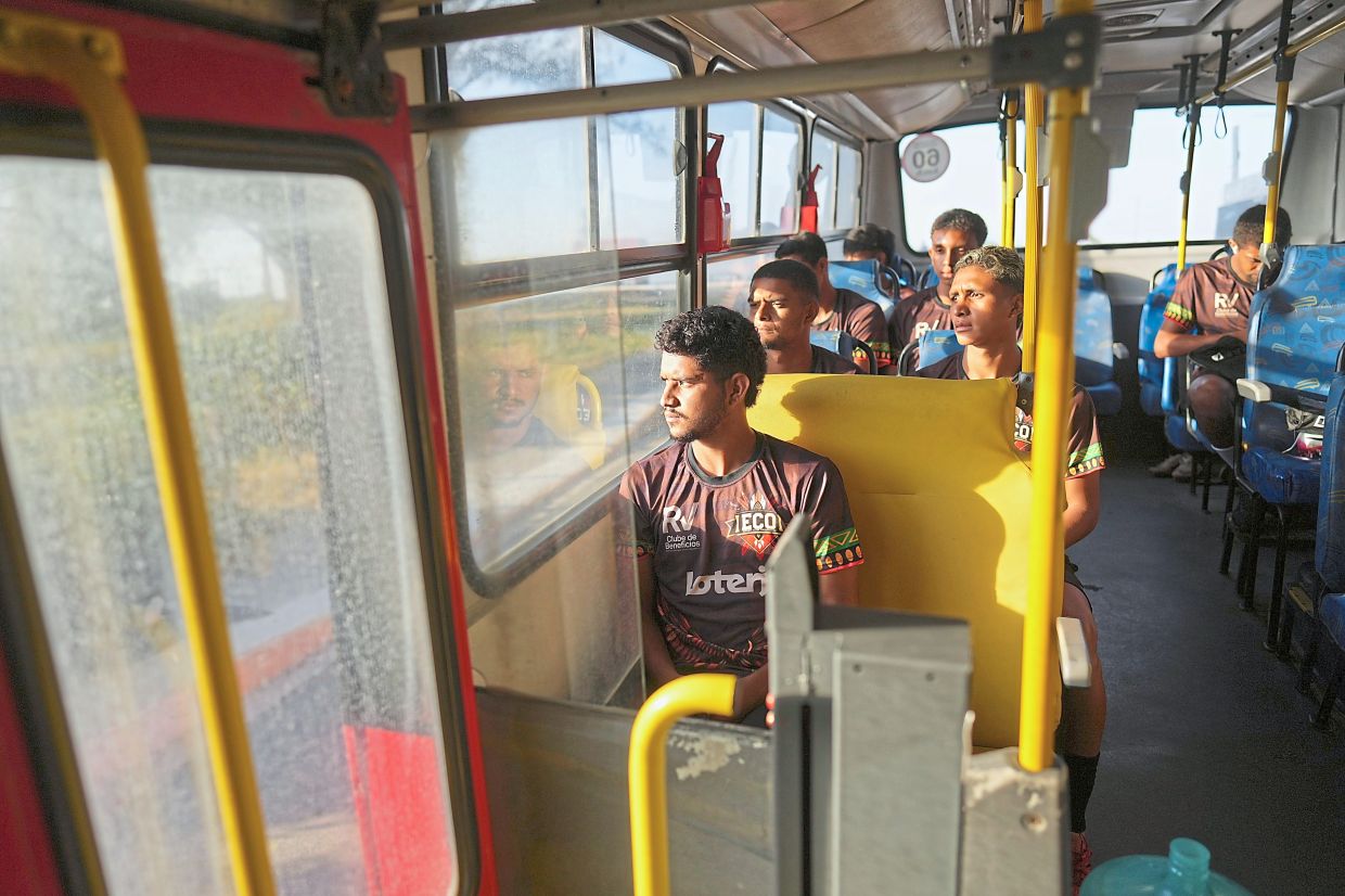 Players ride a bus to practice.