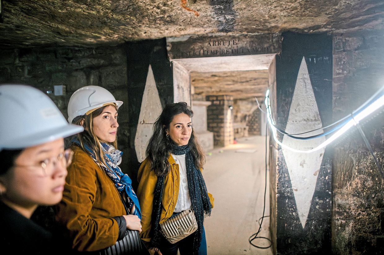 Cayralat (right) said that it was challenging to find workers who were fit enough and willing to work 1.8m underground in cramped and damp spaces, and surrounded by bones.