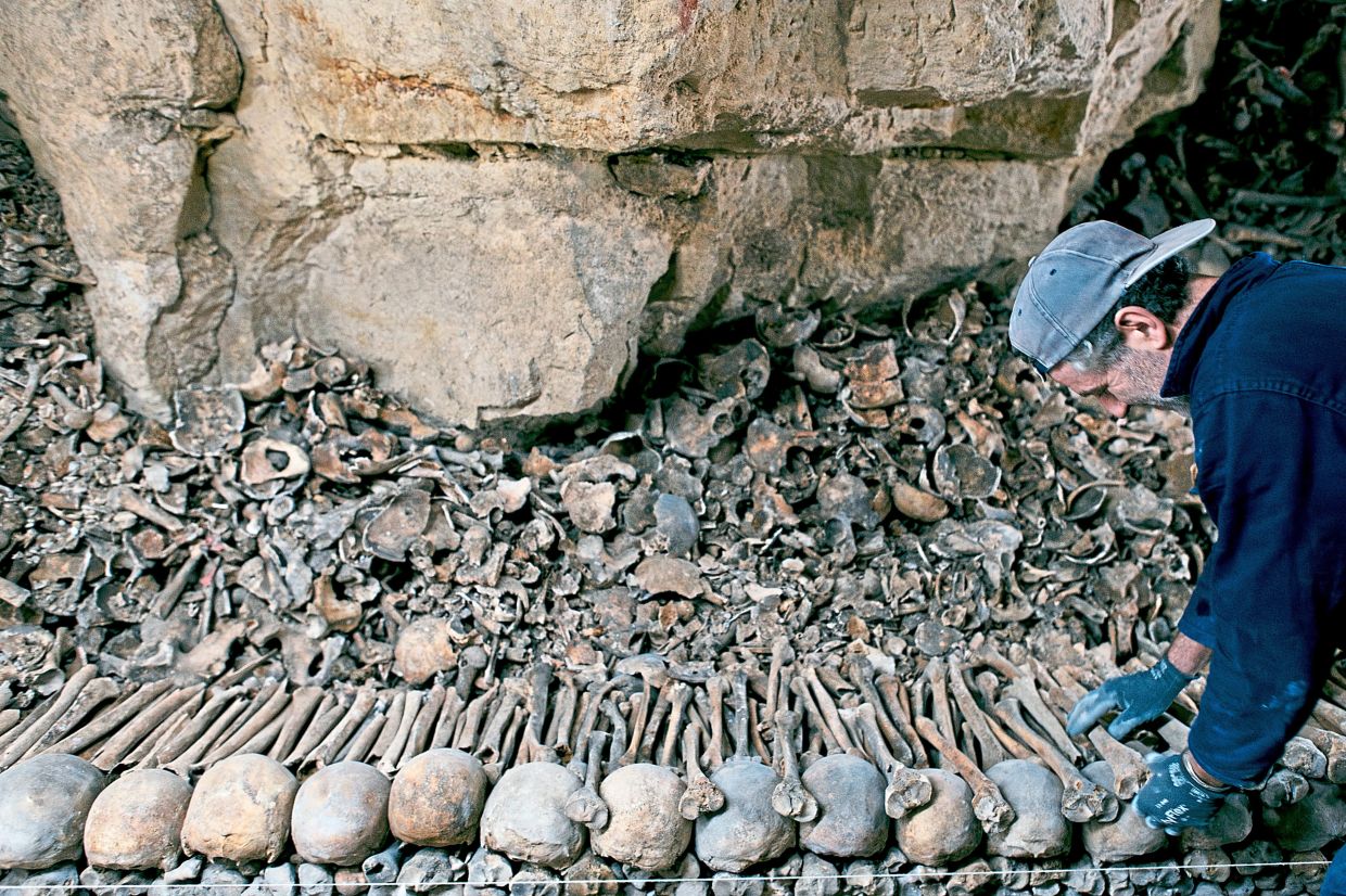 From floor to ceiling, they are lined with bones, femur by f