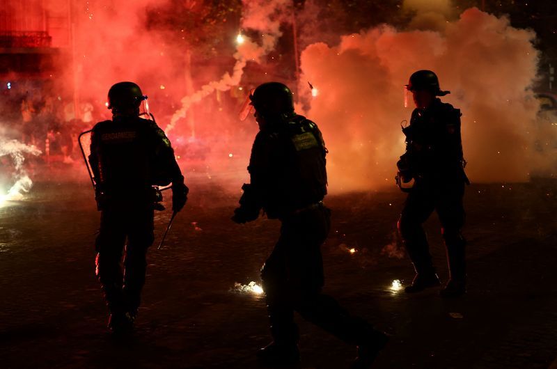 Some storefronts in Paris were destroyed while ⁠rioters also torched cars and stands of rental bikes, police ​said.