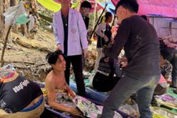 Survivors advise rescuers in search for last two stuck in Laos cave