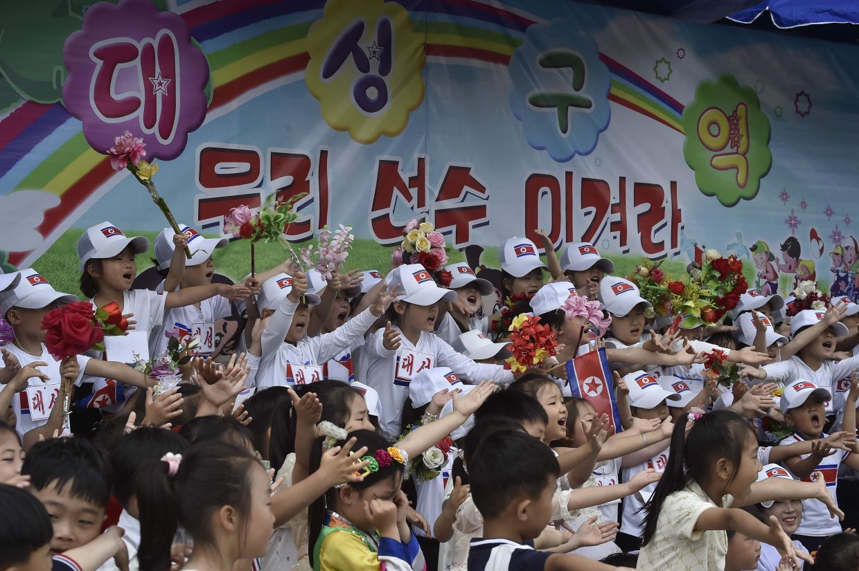 Children of the Daesong District cheer on their players at the joint friendship gathering to mark the 76th anniversary of the International Children's Day at the Taesongsan Pleasure Park in Pyongyang on Monday, June 1, 2026. -- Photo by KIM Won Jin / AFP
