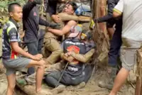 Rescuers find new access route in search for two missing Laos miners
