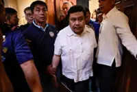 Philippine senator Jinggoy Estrada, the son of a former president, surrenders over graft case