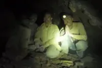 Rescue mission in Laos moves into second week - Rescuers seek new route to two missing in cave