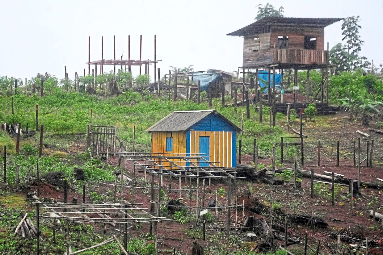 Construction is visible in Nova Conquista or New Conquest, where families are building houses near the centre of Oiapoque. - AP
