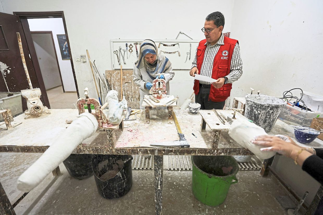 Dr Ahmed Musa, director of the Physical Rehabilitation Programme at the ICRC in Gaza, at a prosthetics workshop at the Artificial Limbs and Polio Centre in Gaza City. — Reuters 