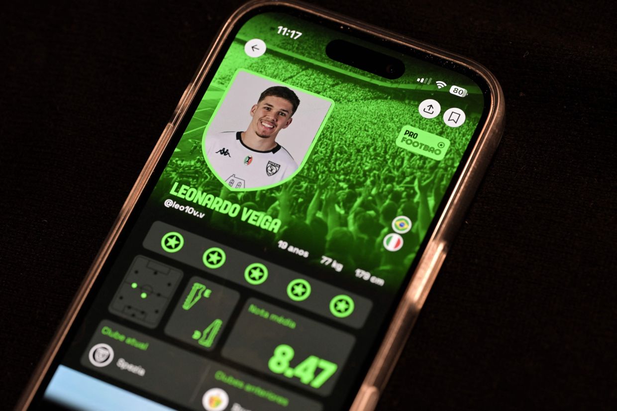 Veiga is seen on the screen of the Foot Bao app, in Sao Paulo, Brazil.