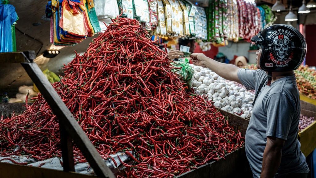 Monthly inflation in Indonesia doubled in May, driven by food prices and particularly chilli in the hot sauce-addicted country, the BPS statistics agency said.