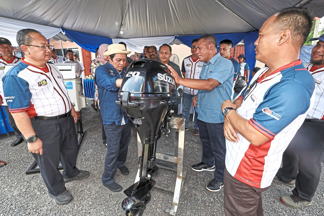 Official get-together: (from left) Director-general of the Legal Affairs Division Datuk Zamri Misman, Azalina and Johor education and information committee chairman Aznan Tamin at a Madani event in Bandar Penawar, Johor. — Bernama