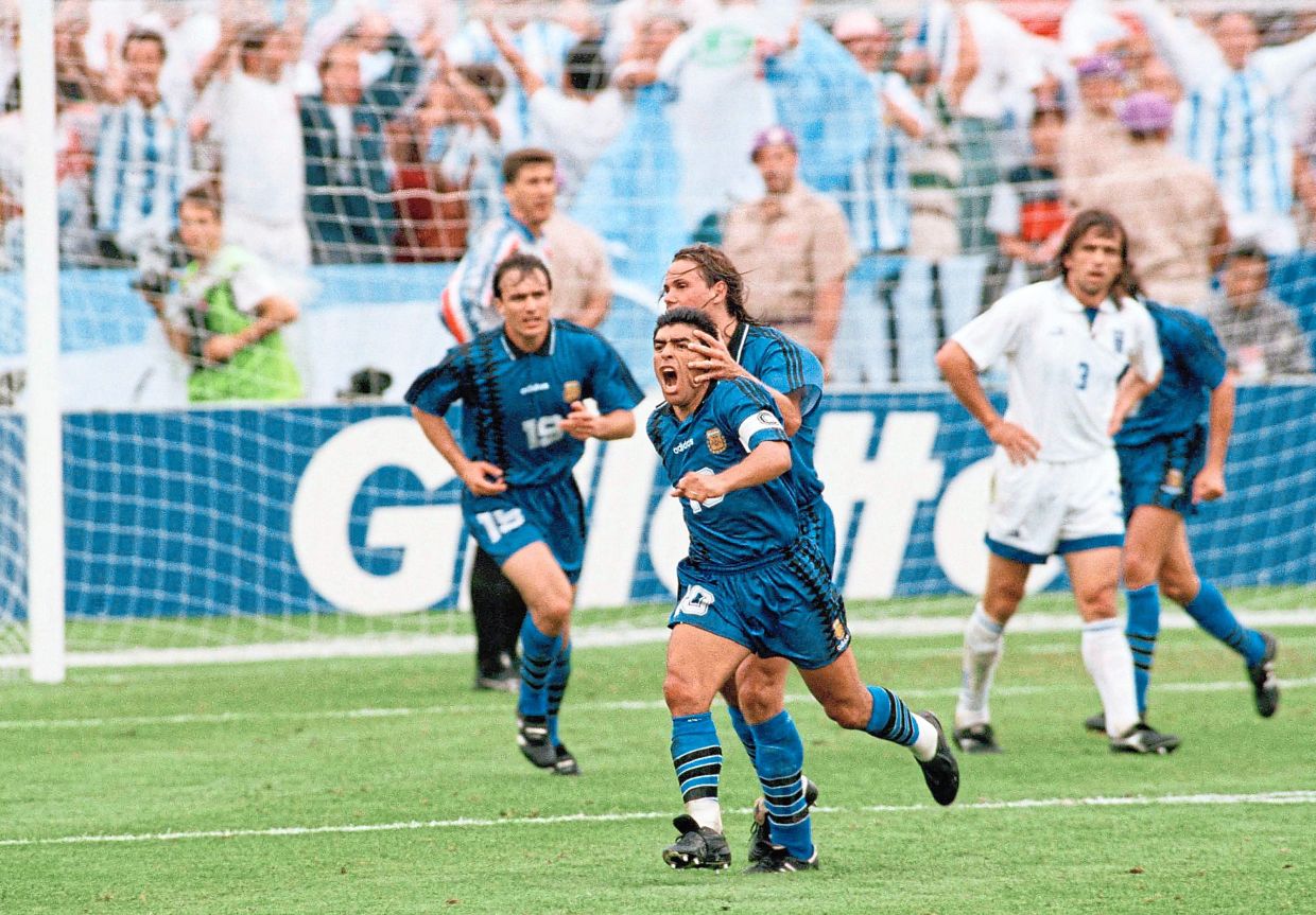 Short-lived joy: Maradona celebrating manically after scoring against Greece. He was axed after testing positive for drugs. — AP