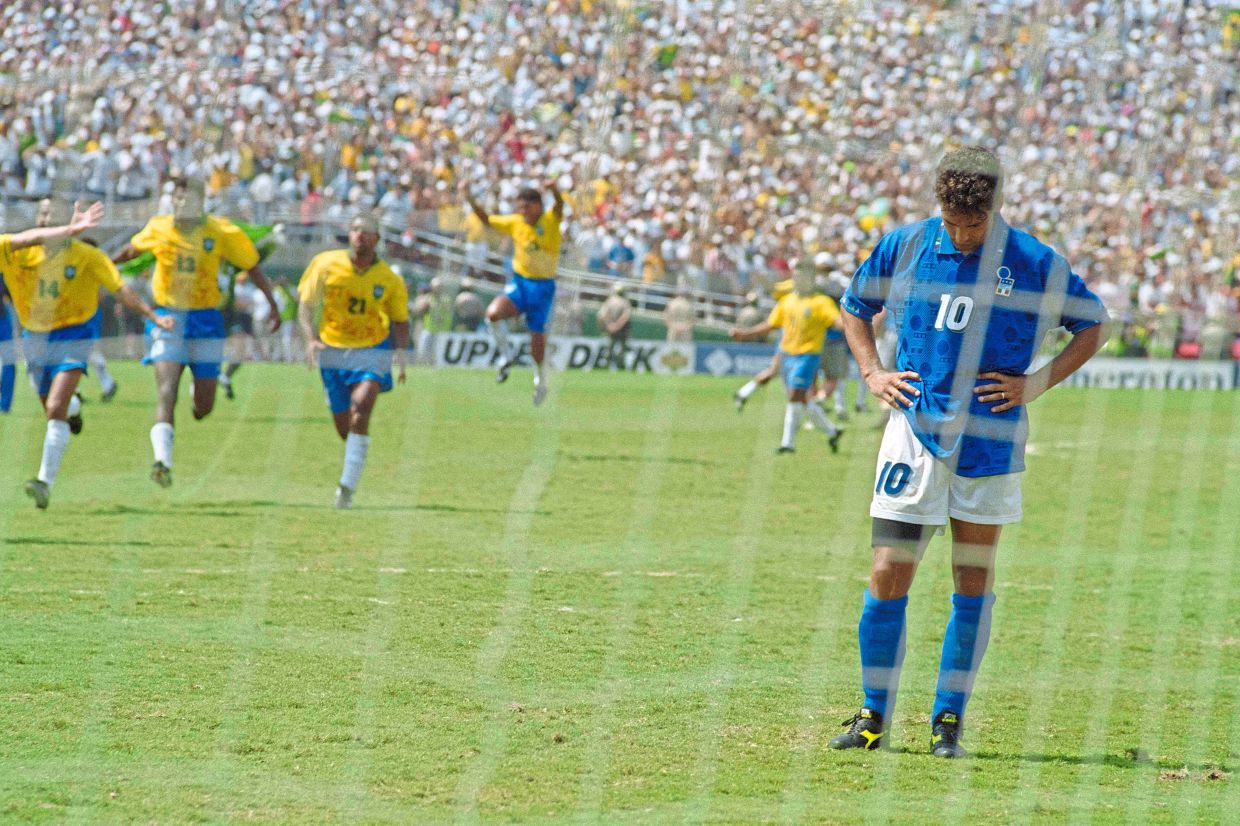 Tears of Buddha: Italy’s Roberto Baggio stands dejected after missing the penalty that handed Brazil the Cup. — AFP