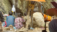 Rescue teams pump water from Lao cave, hoping to reach last trapped men
