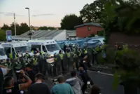UK interior minister condemns violent reaction to handcuffed student's death