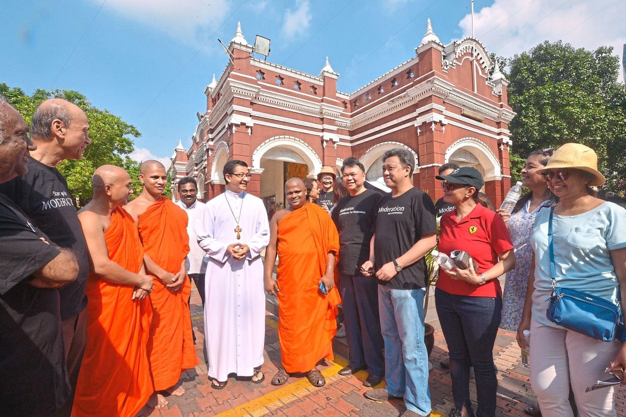 Championing unity: Chun Wai (second from right) with moderation advocates and religious leaders during a Harmony Walk in Brickfields, Kuala Lumpur, in 2015. — RAJA FAISAL HISHAN/The Star