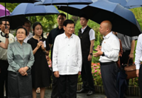 Lao president visits Zhejiang to learn about China's green development practices