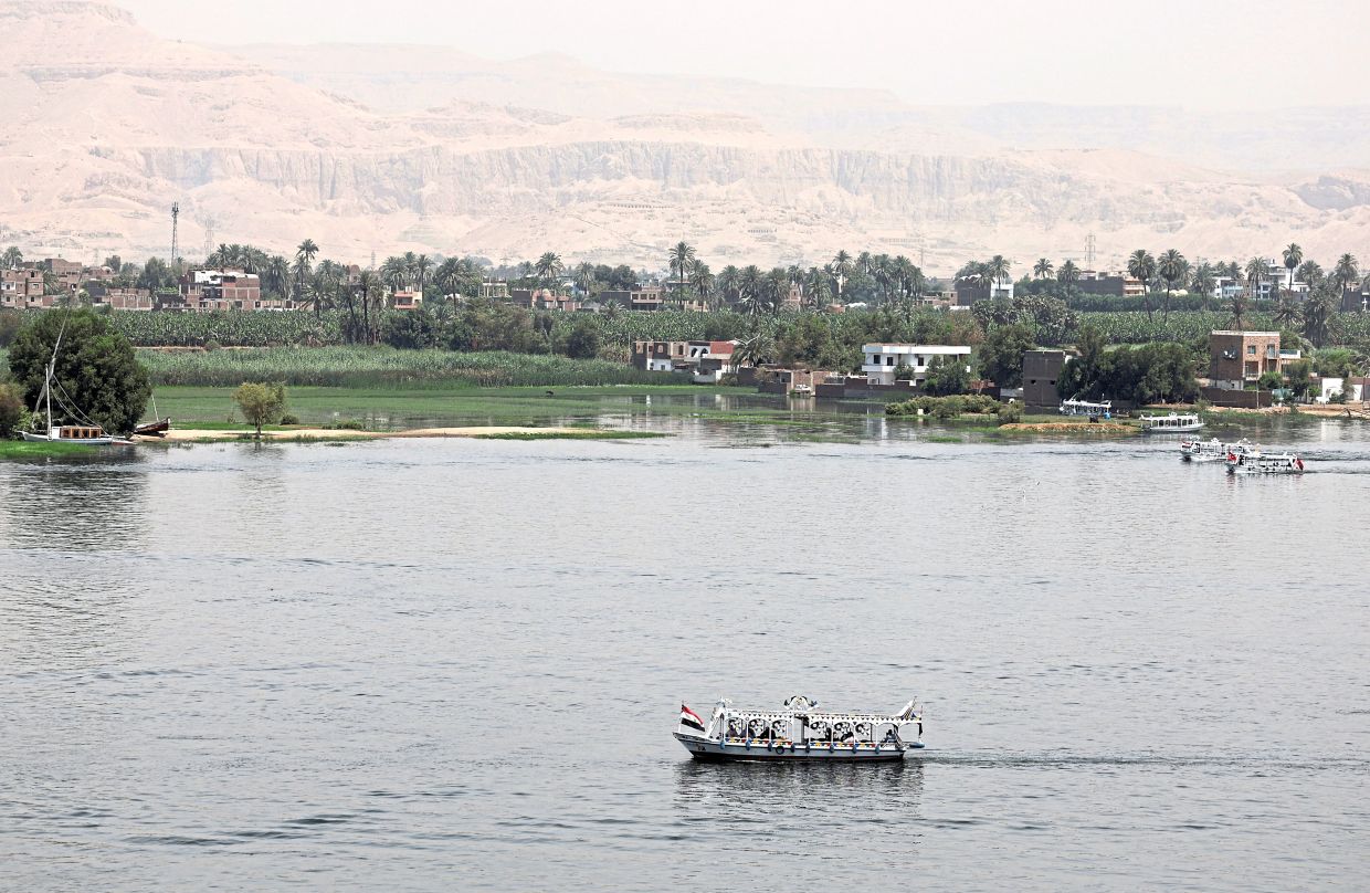 A motorised tourist boat sailing on the Nile. — Reuters