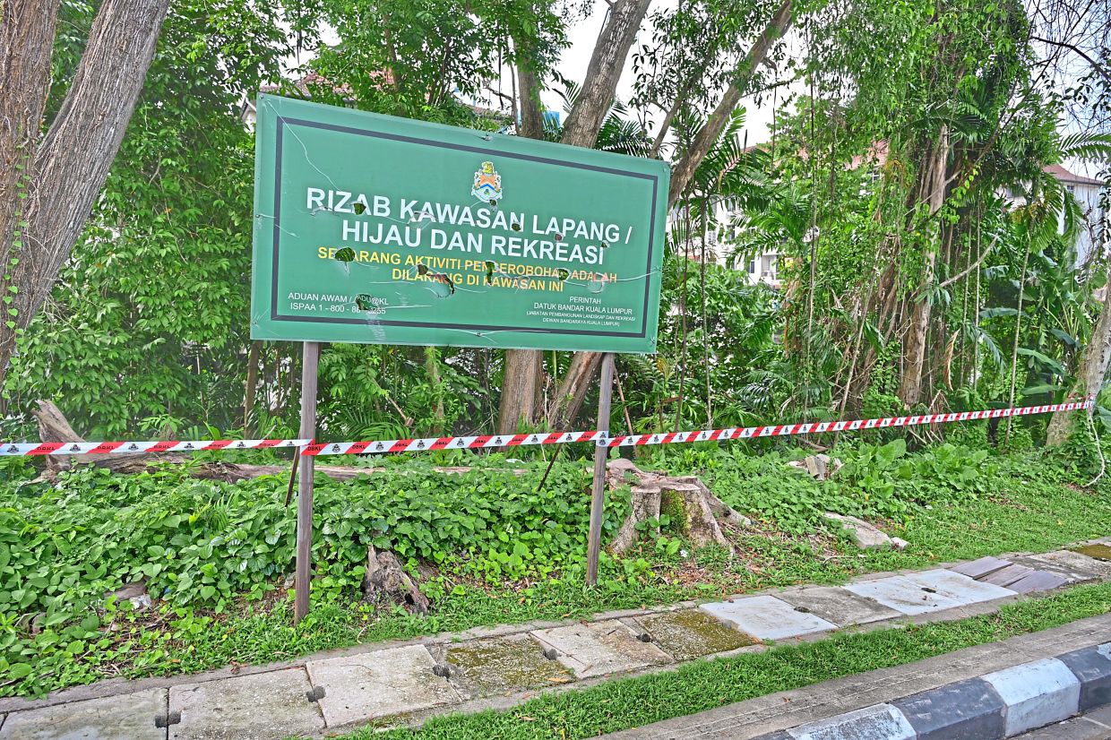 A DBKL signboard marks the gazetted green and recreational reserve land near Nova 2 Apartments.