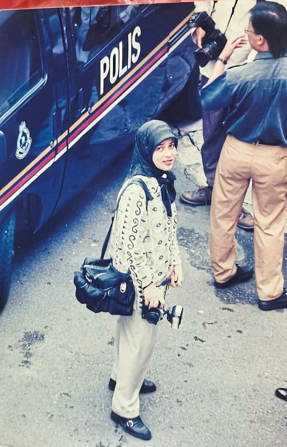 Azlina photographing proceedings during a court assignment. Photo: Filepic