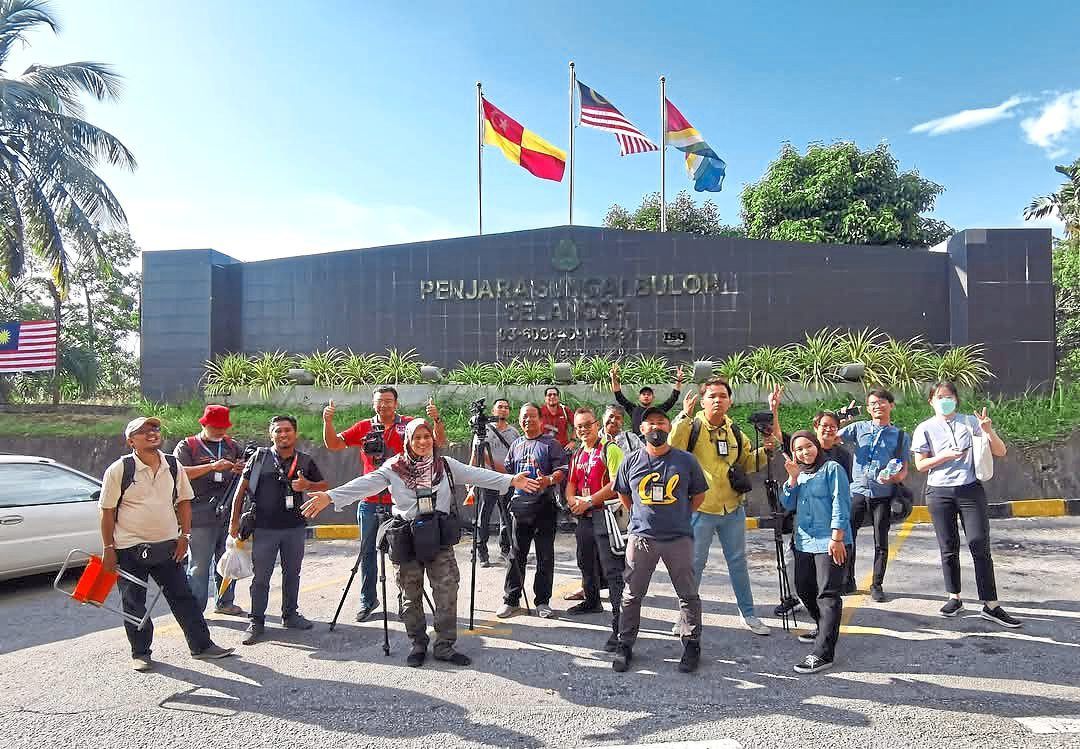 Azlina (fifth from left) has spent over three decades documenting news across Malaysia and abroad. Photo: Filepic