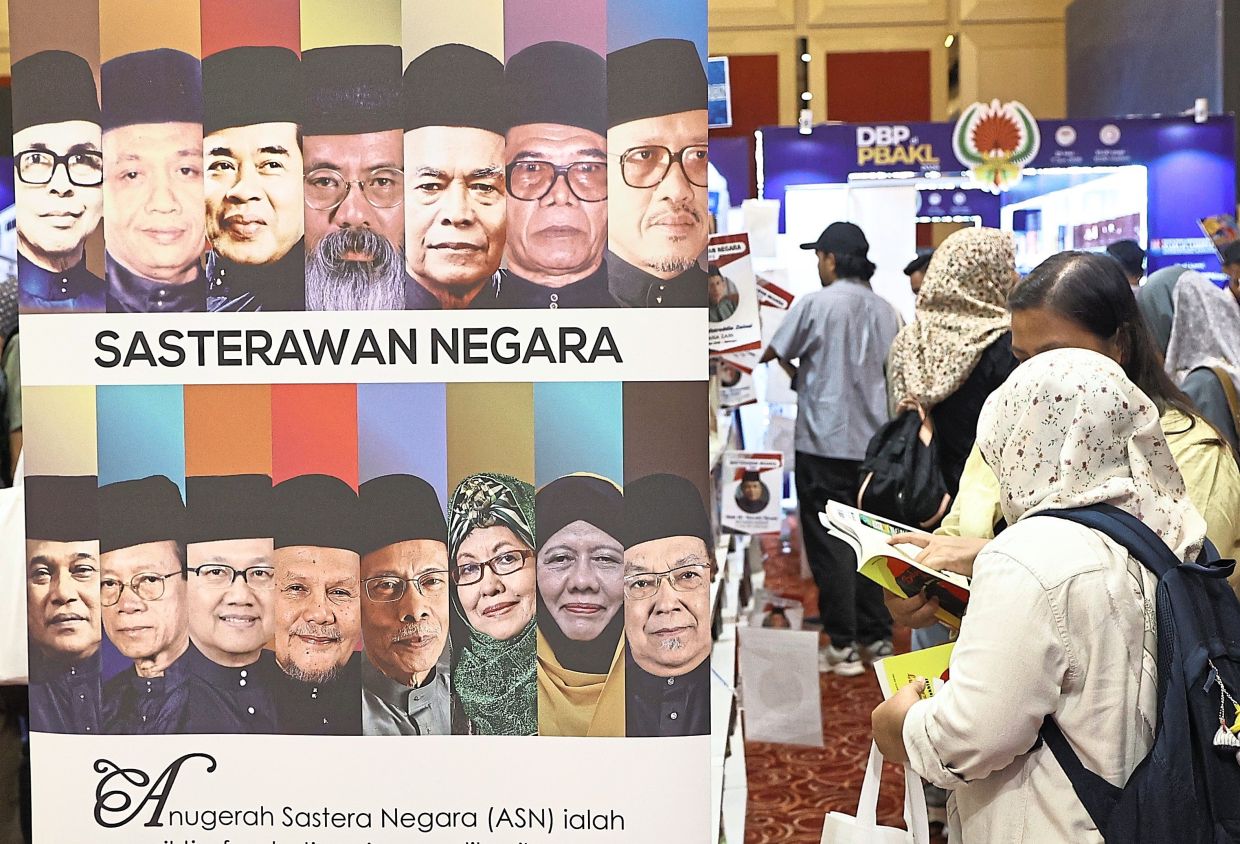 Visitors walk past a section dedicated to the works of Malaysia’s National Literary Laureates at PBAKL 2026. Photo: The Star/Azman Ghani