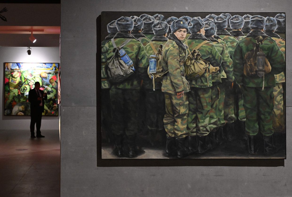 A visitor tours 'The Russian Imperative' art exhibition at the Manezh Central Exhibition Hall in Saint Petersburg. Photo: AFP 