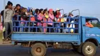 Truck transporting workers in Cambodia overturns, injuring 27