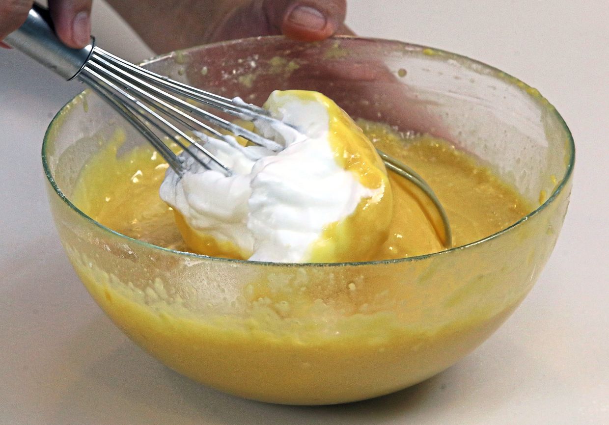 Whisk the egg whites into a meringue and fold into the chiffon batter in batches.