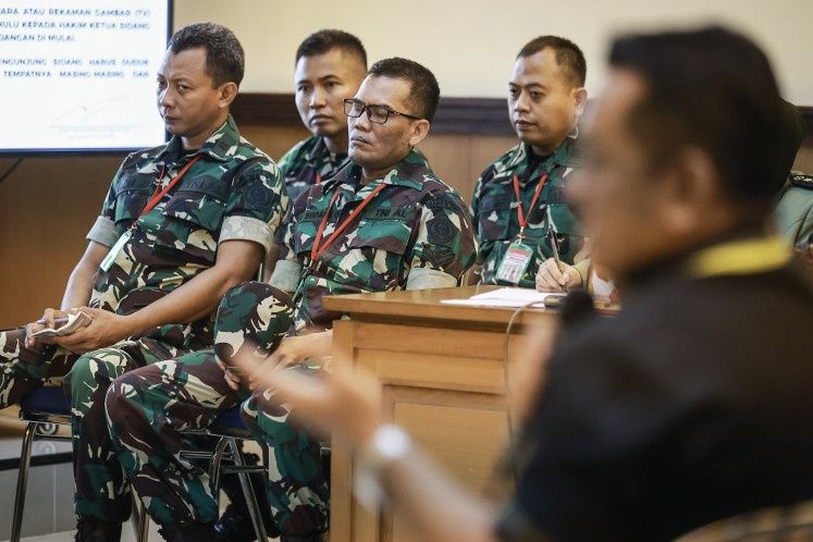 Defendants First Lt. Budhi Harytanto Cahyono (from left), First Lt. Sami Lakka, Second Sgt. Edi Sudarko and Capt. Nandala Dwi Prasetya attend a hearing in the trial of the acid attack against Commission of Missing Persons and Victims of Violence (Kontras) activist Andrie Yunus at the Jakarta Military Court in Jakarta on June 2, 2026. - Photo: Antara