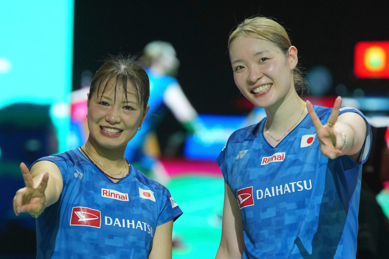 Japan's Yuki Fukushima (left) and Mayu Matsumoto celebrate after defeating China's Liu Shengshu and Tan Ning in their women's doubles final match at the Indonesia Open badminton tournament in Jakarta, Indonesia, Sunday, June 7, 2026. -- AP Photo/Achmad Ibrahim