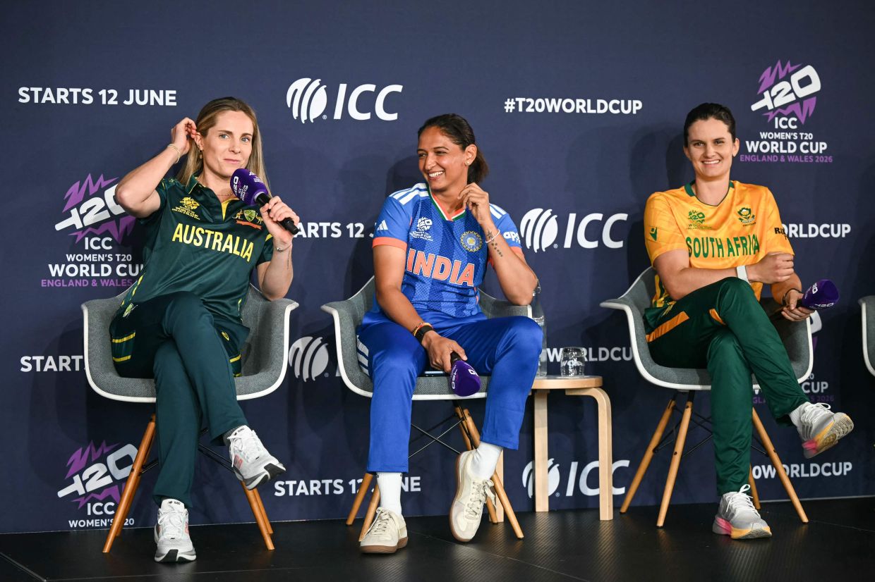 Australia's Sophie Molineux (L), India's Harmanpreet Kaur (C) and South Africa's Laura Wolvaardt speak as part of The Captains' Carnival, the activation event for the ICC Women's T20 cricket world cup 2026, in central London on June 7, 2026. -- Photo by JUSTIN TALLIS / AFP