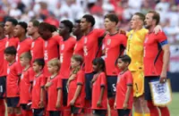 Soccer-England labour to win over New Zealand as Germany defeat USA
