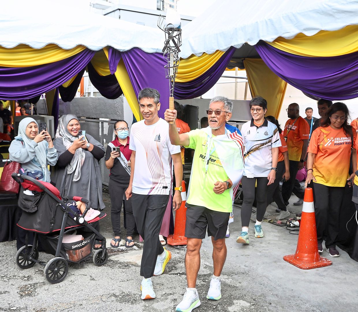 He takes to the streets on foot for the gold ribbon, a symbol of childhood cancer awareness and carries a message of hope for young patients battling the deadly disease.