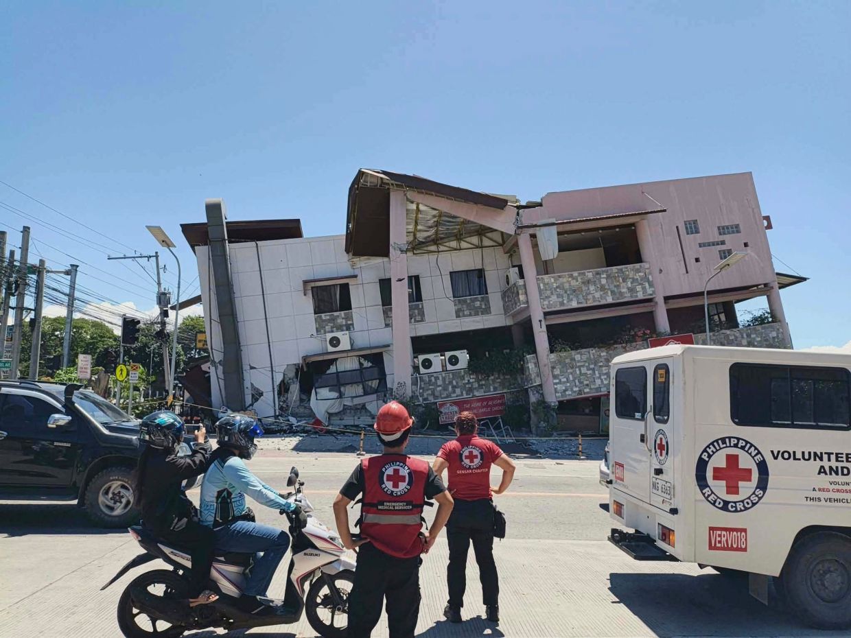Philippine Red Cross rescuers inspecting the damage in General Santo on June 8, 2026. - Philippine Red Cross via AP