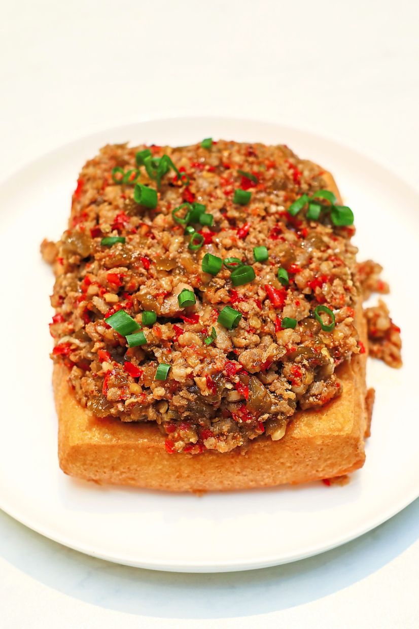 The restaurant's homemade tofu boasts the softest, silkiest texture and is topped with minced pork and preserved vegetables for added dimension.