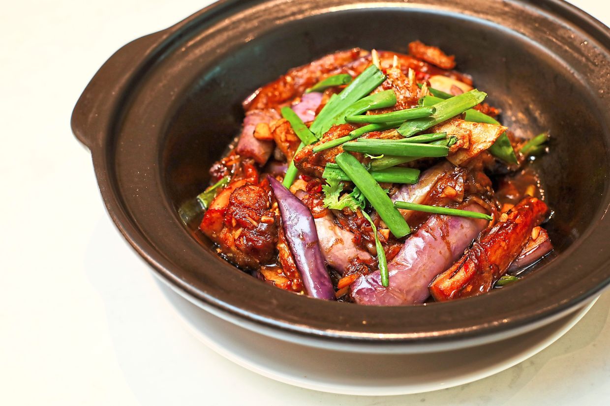 Brinjal and grouper fish head in a ridiculously addictive sauce make for a hugely memorable meal.