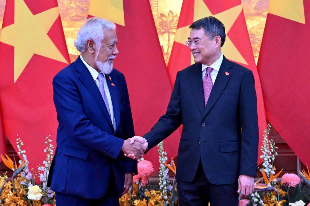 Vietnam Prime Minister Le Minh Hung and Timor-Leste Prime Minister Xanana Gusmao greeting each other at the Government Office in Hanoi on June 9, 2026. -AFP