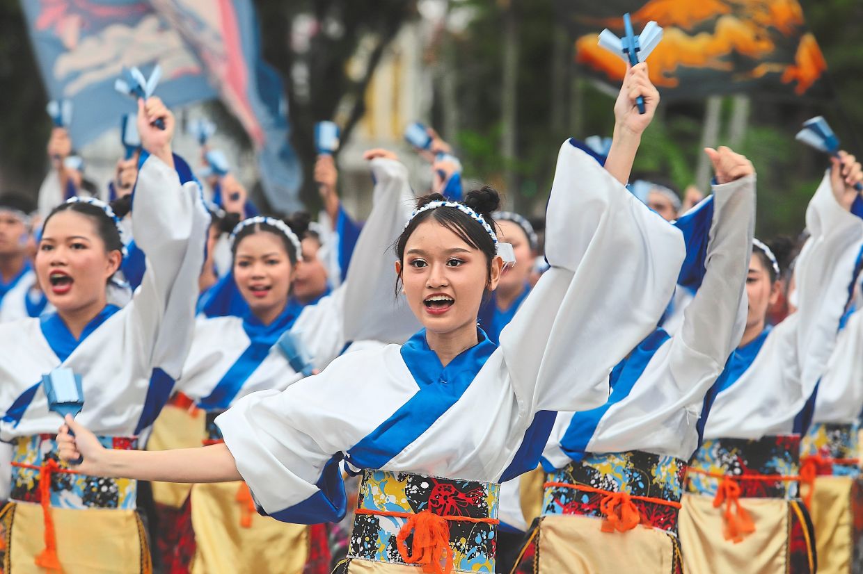 Teams performing their routines in front of the Town Hall at the Esplanade during the Penang Yosakoi Parade 2025. — File photos